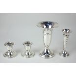 A pair of Elizabeth II silver dwarf candlesticks, together with two silver bud vases