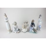 Five Nao porcelain figures including an owl, a girl with rabbits, a girl with a doll, a girl with