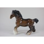 A Beswick porcelain model of a cantering shire horse in brown gloss