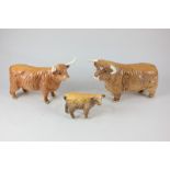 Three Beswick porcelain models of Highland cattle, bull (2008), cow (1740), and calf (1827D)