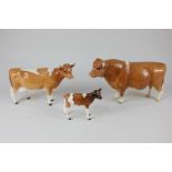 Three Beswick porcelain models of Guernsey cattle, bull CH Sabrinas Sir Richmond 14th (1451), cow