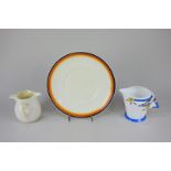 A Clarice Cliff bizarre porcelain large saucer, a Shelley porcelain jug, and a Belleek double