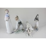 A Lladro porcelain figure of a girl picking flowers, a Nao figure of a ballet dancer, a Nao figure