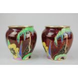 A pair of Carlton Ware porcelain Prickly Pansy vases with floral design on red lustre ground, 12cm