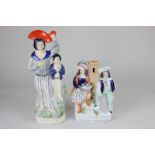 A Victorian Staffordshire pottery flat back figure group of a fisherman and fish seller, together