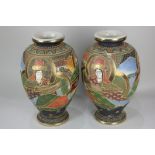 A pair of Japanese Satsuma pottery baluster vases depicting a central female deity with a male deity