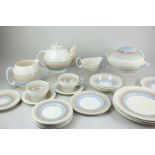 A Susie Cooper for Crown Works Burslem Art Deco part tea and dinner service with blue, orange and