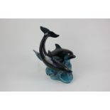 A Poole Pottery figure group of two dolphins on wave base, 24cm high