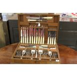 Early 20th cent. Electroplated canteen of cutlery in walnut veneered case minus 1 table knife.