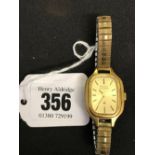 Watches: Bulova Accutron ladies yellow metal watch with expanding bracelet.