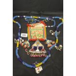 20th cent. Ethnic bead pure and blue beads, jewellery and bag.