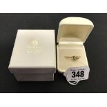 Designer Jewellery: 18ct brilliant cut solitaire diamond, approximately .20ct. cross over setting,