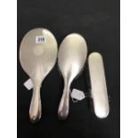 Hallmarked Silver: Engine turned dressing table brush set, mirror, clothes and hair brushes.