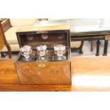 19th cent. Burr walnut Tantalus box, three decanters with pouring lips, plush lined.