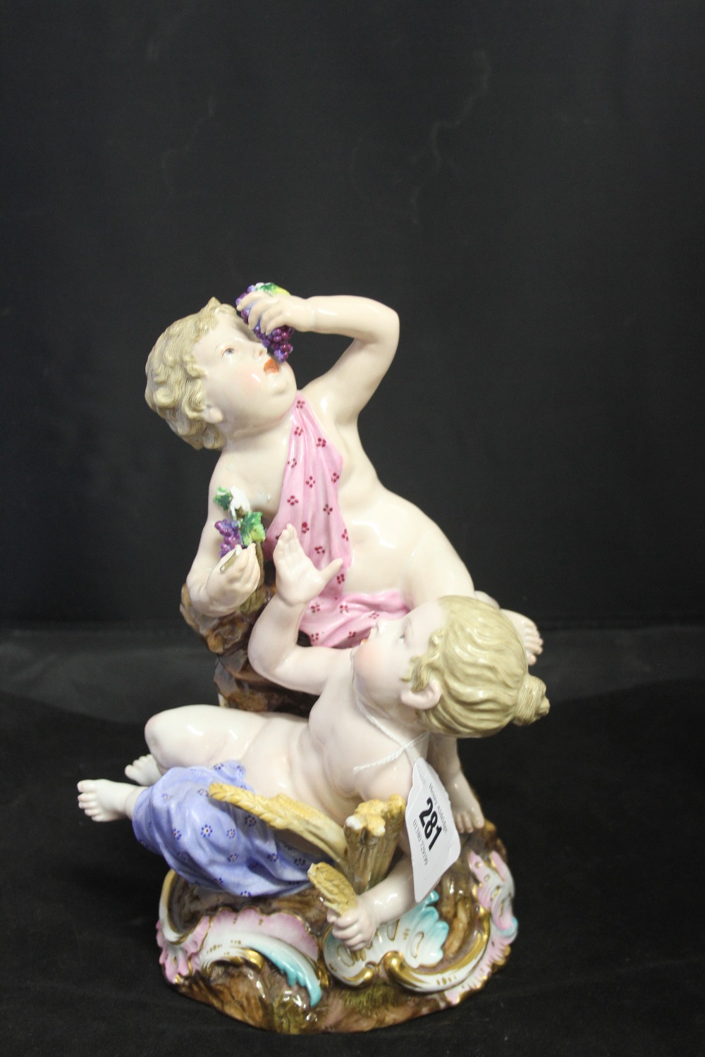 Early 20th cent. Meissen: Bacchanalian Putti cross swords marks to base and impressed 1236 red oxide