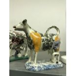 Early 19th cent. Pearlware: Cow creamer and milk made sponge ware decoration. The cow is yellow