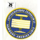 ZEPPELIN/AIRSHIP: Graf Zeppelin luggage tag, vibrant blue, yellow and white. Graf Zeppelin flying