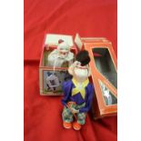 Toys: 20th cent. post 1946 Clockwork balancing clown with 'original' box plus a bisque headed "