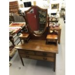 Early 20th cent. Mahogany dressing chest 2 over 1, shield back mirror on inlaid columns flanked by