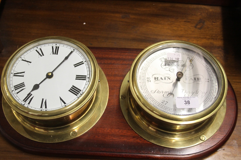 Clocks: 20th cent. Brass cased Bulkhead style clock and barometer Taylor of England mounted on a