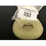 Hallmarked Gold: 18ct. Diamond five stone boat shaped ring, 2.3grams inclusive. Approx. .30 carat