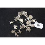 Hallmarked Silver: Charm bracelet plus extra charms. 3½ozs.