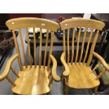 20th cent. Beech open arm, slat backed farmhouse chairs. Turned and shaped supports and