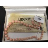 Liberty: Pink coral graduated necklace with crystal spacers, diamond & white gold clasp with