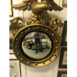 Early 20th cent. Convex gilt circular mirror with later editions.