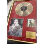 Music Memorabilia: CD gold disc from the film Evita, personally signed by Madonna. Framed 27½ins x