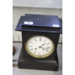 Clocks: Black slate with English movement, serial number 33623, strikes the hour. Approx. 10ins x