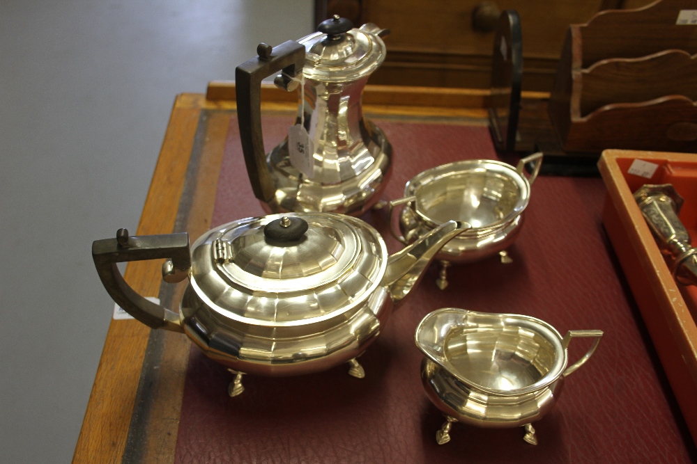 Plated Ware: Tea set comprised of hot water pot, teapot, sugar bowl, and a milk jug (4).