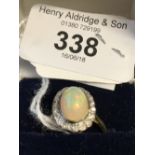 Hallmarked Gold: Opal cabochon & diamond cluster ring 18ct.