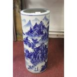 20th cent. Blue and white umbrella stick stand Oriental scenes 9½ins. dia. x 23ins. high.