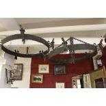 Lighting: Iron circular medieval style 5 branch ceiling lights - a pair. Diameter 29ins.