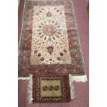 20th Carpets: Afghan carpet, ivory ground, red borders, central medallion with Islamic motifs &