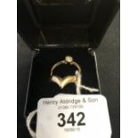 Gold Jewellery: Hallmarked 9ct. gold rings, 1 with a white stone, chevron shaped. 3½grams.