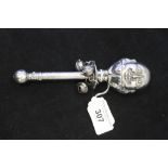 White Metal: Baby's rattle "Humpty Dumpty" double head, 3 bells, inscribed on the handle "Victoria