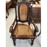 19th cent. Mahogany hall chair, rattan seat and back, heavily carved, barley twist columns and