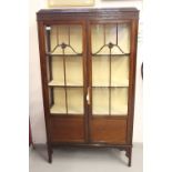 19th cent. Mahogany display cabinet twin doors with moulding decoration to the glaze, solid bottom