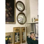 20th cent. Mirrors: Oblong mirrors set in gilt panel frames, decorated with pute in releaf 12ins.
