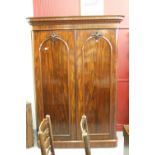 19th cent. Flame mahogany twin door robe opening to reveal 4 drawers and 2 hanging compartments