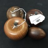 Treenware wood turned apples in Indian laurel wood, walnut and mahogany plus a mahogany egg.