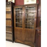 20th cent. Oak lead glazed bookcase. 40ins. x 72ins. x 10ins.