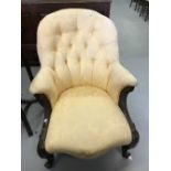 19th cent. Mahogany button back gentleman's chair, serpentine front, heavily carved cabriole