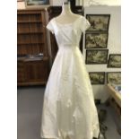 Fashion: Wedding dress, Caroline Parkes, London purchased from Harrods. The dress is ivory silk, has