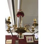 19th cent. Lighting: Bohemian ruby glass, five branch gilt brass ceiling chandelier with white