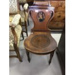 19th cent. Mahogany hall chair. Scroll back with ebonised decoration, painted central medallion with