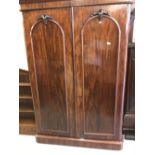 19th cent. Flame mahogany twin door robe opening to reveal 4 drawers and 2 hanging compartments.