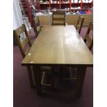 20th cent. Honey oak extending dining table, 1½ins. thick plank top and five rush seated matching